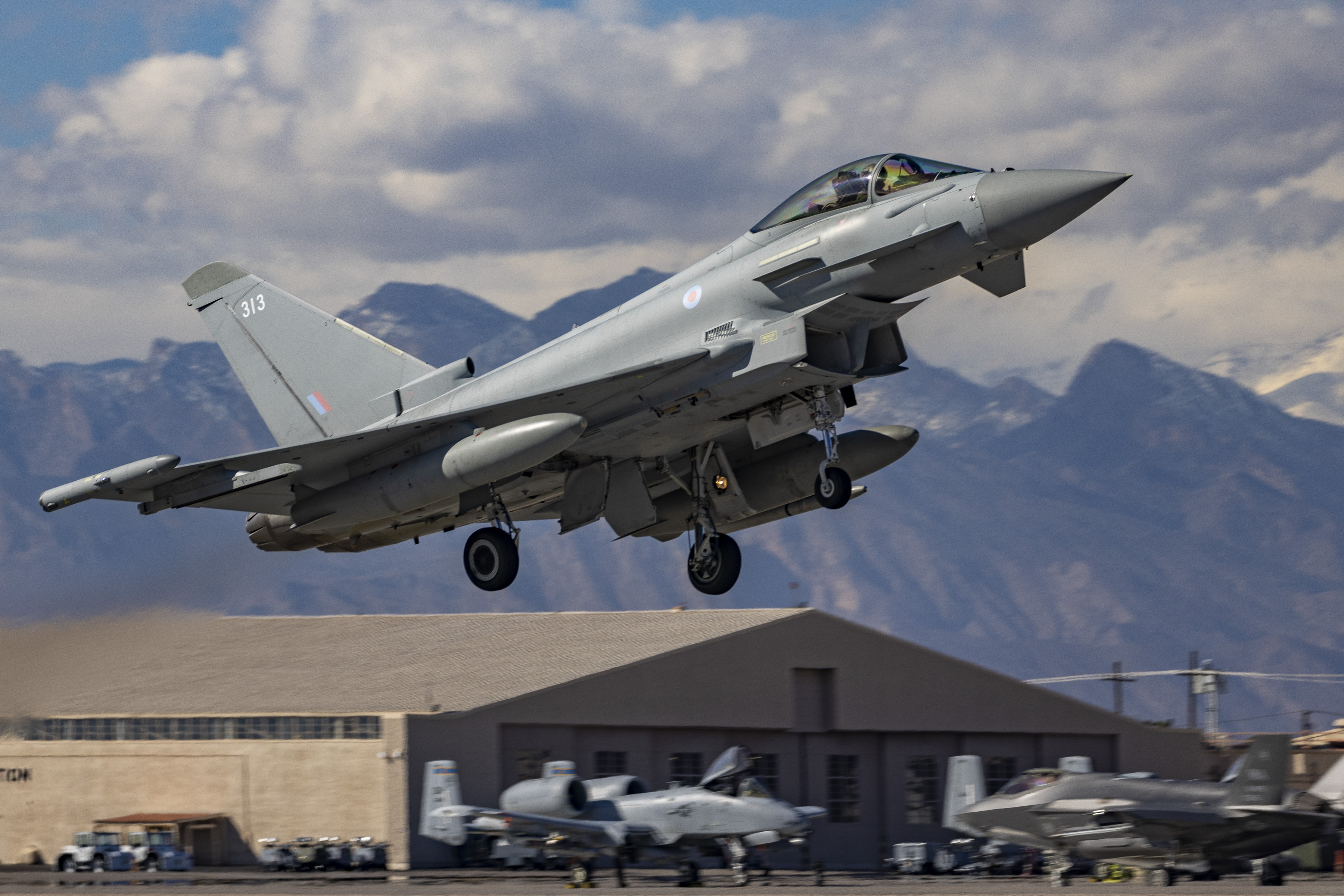Image shows RAF Typhoon aircraft taking off from the airfield.